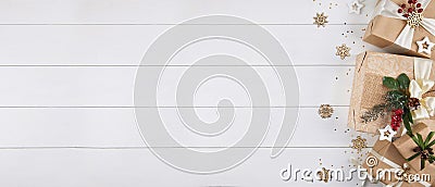 Christmas banner with border of gift boxes on white wood background Stock Photo