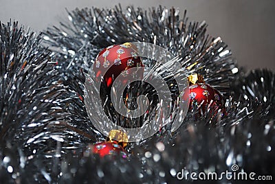 Christmas baubles nesting in silver tinsel 4 Stock Photo