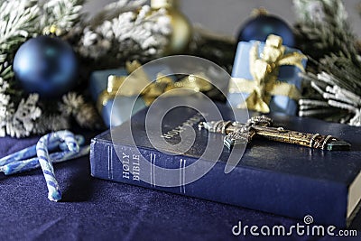 Christmas bible cross and candy canes on blue Stock Photo