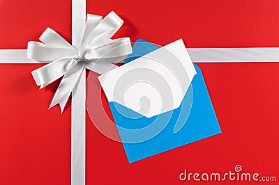 Christmas or birthday card, white gift ribbon bow, red background, copy space Stock Photo