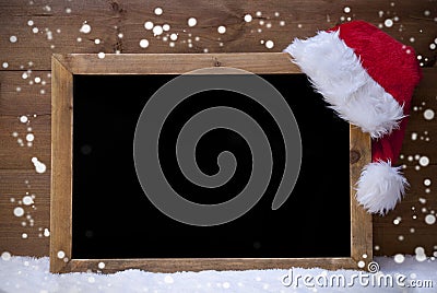 Christmas Blackboard, Santa Hat, Copy Space, Snow, Snowflakes Stock Photo