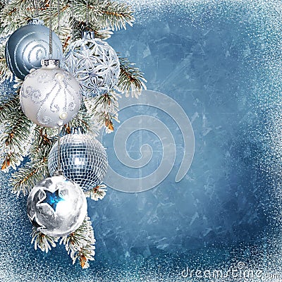 Christmas blue snowy background with beautiful balls, pine branches with frost and place for text or photo Stock Photo