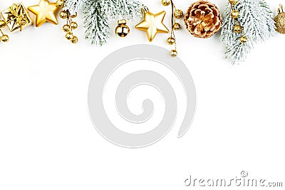 Christmas border composition. Gold decorations and green fir branch on white background. Xmas flat lay top view Stock Photo