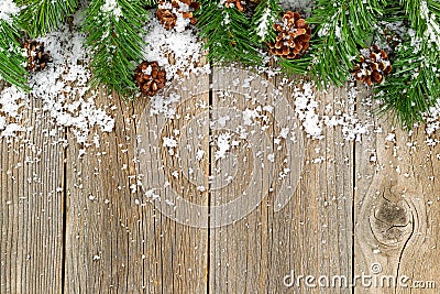 Christmas border decorations with snow on rustic wooden boards Stock Photo