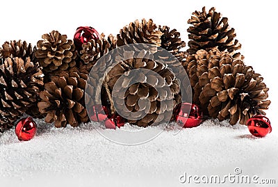 Christmas border design with snow, jingle bells and pinecones. Stock Photo