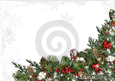 Christmas border of holly, mistletoe, cones over white background. Stock Photo