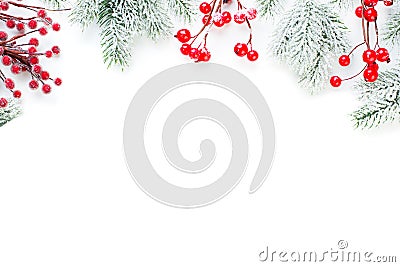 Christmas border of red holly berries and snowy green fir branch isolated on white background Stock Photo