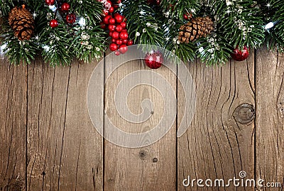 Christmas branch top border on rustic old wood Stock Photo