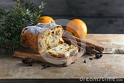 Christmas cake, in germany christstollen with fir branches, oran Stock Photo