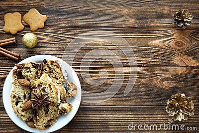 Christmas cake and gingerbread cookies on brown table. Free space for text. Stock Photo