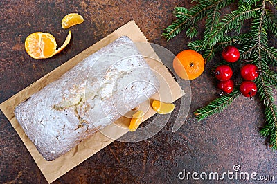 Christmas cake with nuts, dried fruit, tangerines. Stock Photo