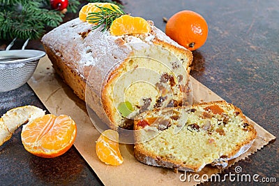 Christmas cake with nuts, dried fruit, tangerines. Stock Photo