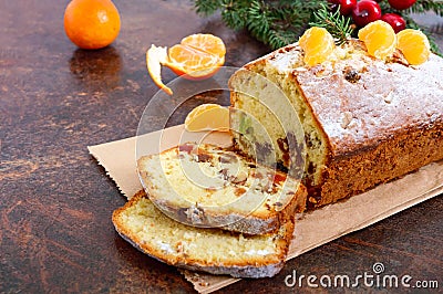 Christmas cake with nuts, dried fruit, tangerines. Stock Photo