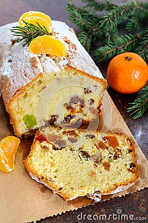 Christmas cake with nuts, dried fruit, tangerines. Stock Photo