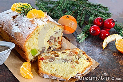 Christmas cake with nuts, dried fruit, tangerines. Stock Photo