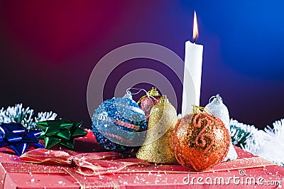 Christmas candle and ornaments Stock Photo