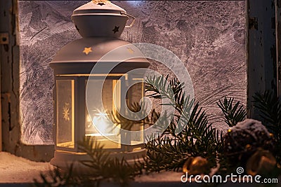 Christmas - candles glow in the steamy window Stock Photo