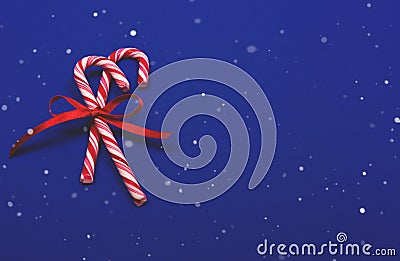 Christmas candy canes on blue background. Stock Photo