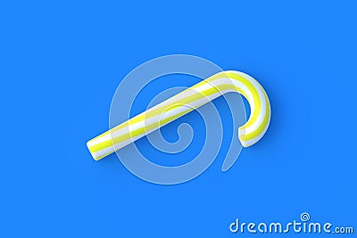Christmas cane, candy with yellow stripes on blue background Stock Photo