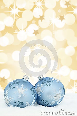 Christmas card balls baubles gold golden background stars snow Stock Photo