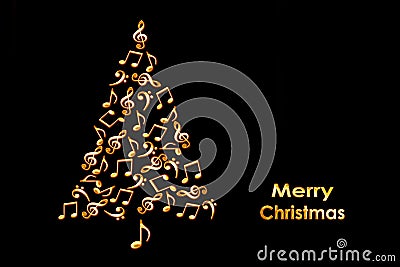 Christmas card with a Christmas tree made of shiny golden musical notes on black Stock Photo