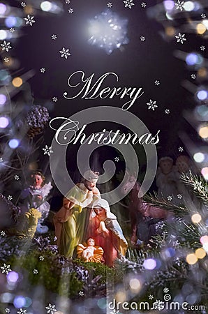 Christmas card with figures of Jesus, Virgin Mary and Joseph on a dark background with the inscription Merry Christmas Stock Photo