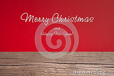 Christmas card, red taxtured paper on wooden background Stock Photo