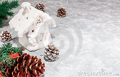 Christmas card. snow-white house, cones. Christmas light background with cones. empty space for text. 2019 year. minimalism Stock Photo