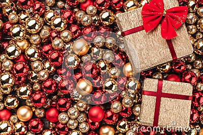 Christmas card. Wallpaper of red and gold baubles. Top view. Gifts packed on one side Stock Photo