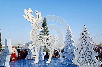 Christmas carved deer figures, Christmas trees Editorial Stock Photo