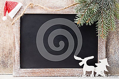 Christmas chalkboard with decoration. Santa hat, stars, Wooden Stock Photo