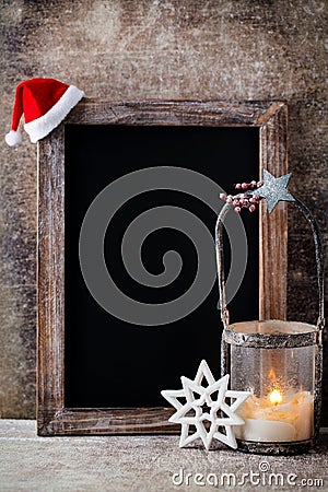 Christmas chalkboard with decoration. Santa hat, stars, Wooden Stock Photo