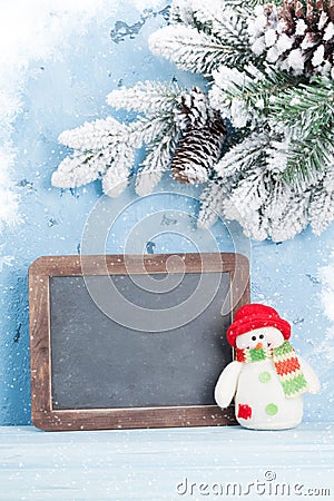 Christmas chalkboard, snowman and fir tree Stock Photo