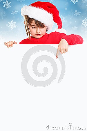 Christmas child kid girl Santa Claus pointing empty banner portrait format snow copyspace Stock Photo