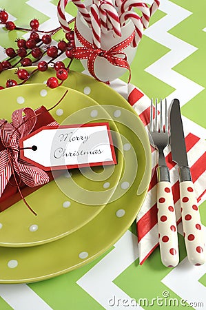 Christmas children family party table place settings in lime green, red and white Stock Photo