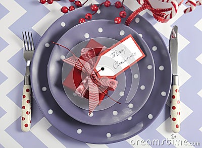 Christmas children family party table place settings in purple, red and white theme Stock Photo