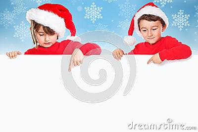 Christmas children kids Santa Claus pointing empty banner snow c Stock Photo