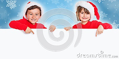 Christmas children kids Santa Claus pointing happy empty banner copyspace copy space Stock Photo