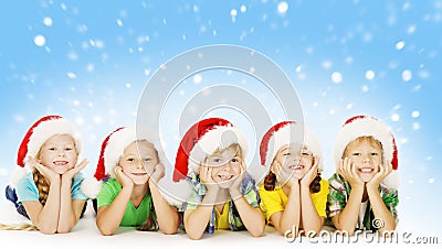 Christmas Children In Santa Helper Hat, Little Xmas Kids Stock Photo