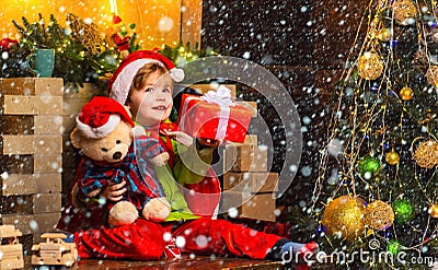 Christmas childs in snow. Dreamy baby toddler on christmas eve. Believe in christmas miracle. Wish to meet santa claus Stock Photo