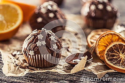 Christmas chocolate delicious muffins sprinkled with topping and white stars Stock Photo