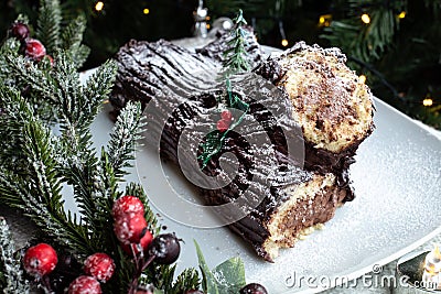 Christmas chocolate log, Buche de Noel, festive holiday cake and decorations Stock Photo