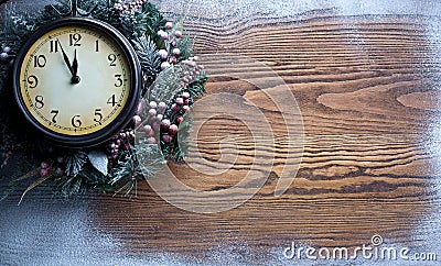 Christmas clock over snow wooden background. Stock Photo