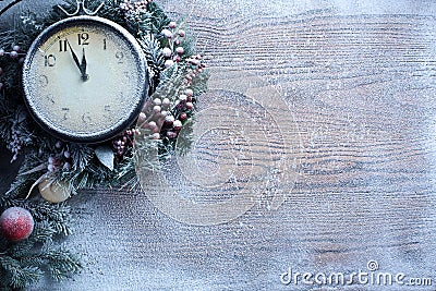 Christmas clock over snow wooden background. Stock Photo