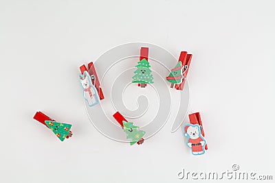 Christmas clothespin on white with christmas tree Stock Photo