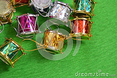 Christmas drums on green background. Stock Photo