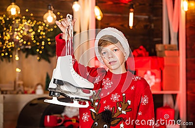 Christmas coming. Christmas mood concept. Santa claus kid. Transform your shoes into ice skates for Winter. New year Stock Photo