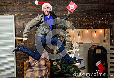 Christmas is coming. Spread happiness and joy. Bearded guy in motion jump. Delivery christmas present. Still have time Stock Photo