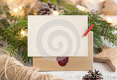 Christmas Composition with a blank card, sealed envelope and fir branches. Holiday mockup Stock Photo