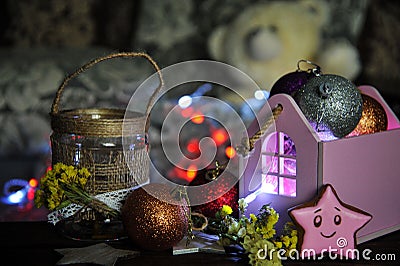 Christmas composition with a candle and Christmas decorations on a table Stock Photo